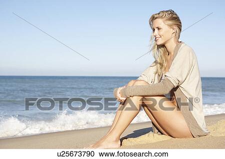 Young Woman Relaxing On Beach View Large Photo Image Stock Image - Young Woman Relaxing On Beach. Fotosearch