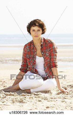 Young Woman Relaxing On Beach View Large Photo Image Stock Photograph - Young Woman Relaxing On Beach. Fotosearch