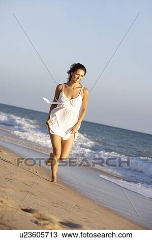 Young Woman Running Along Summer Beach View Large Photo Image Stock Image - Young Woman Running Along Summer Beach. Fotosearch
