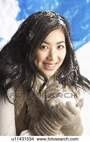 Young Woman Wearing Warm Winter Clothes Holding Snowball In Studio View Large Photo Image Picture - Young Woman Wearing Warm Winter Clothes Holding Snowball In Studio. Fotosearch