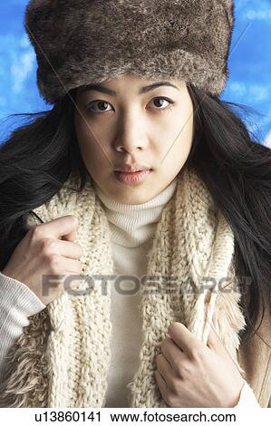 Young Woman Wearing Warm Winter Clothes And Fur Hat In Studio View Large Photo Image Stock Image - Young Woman Wearing Warm Winter Clothes And Fur Hat In Studio. Fotosearch