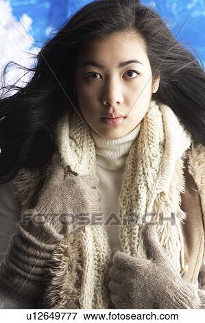 Young Woman Wearing Warm Winter Clothes In Studio View Large Photo Image Stock Photo - Young Woman Wearing Warm Winter Clothes In Studio. Fotosearch