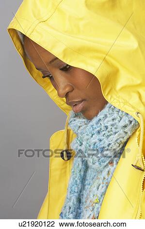 Young Woman Wearing Yellow Raincoat In Studio View Large Photo Image Stock Image - Young Woman Wearing Yellow Raincoat In Studio. Fotosearch