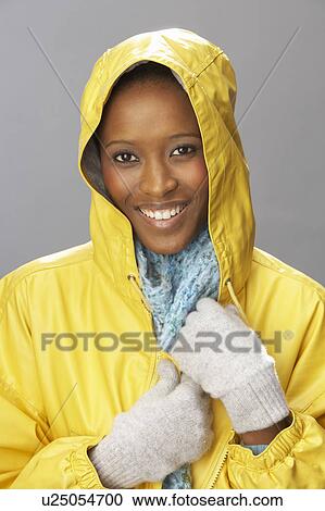 Young Woman Wearing Yellow Raincoat In Studio View Large Photo Image Stock Image - Young Woman Wearing Yellow Raincoat In Studio. Fotosearch