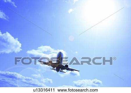 Airplane Flying Under Sky View Large Photo Image Stock Image - Airplane Flying Under Sky. Fotosearch
