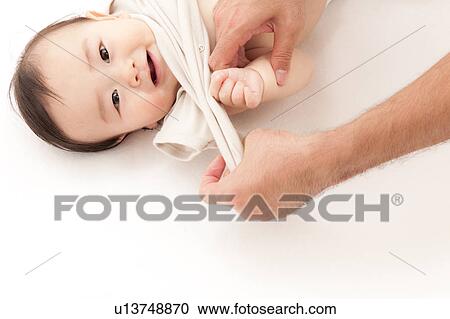 Baby Boy Being Dressed View Large Photo Image Stock Image - Baby Boy Being Dressed. Fotosearch