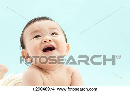 Picture - Baby Boy Looking Up. Fotosearch