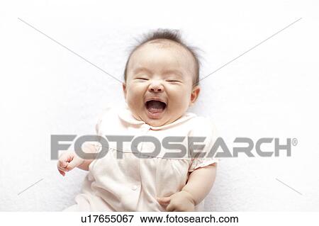 Stock Photo - Baby girl laughing. Fotosearch