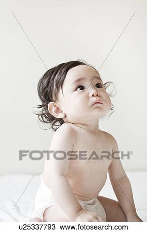 Stock Image - Baby looking up. Fotosearch