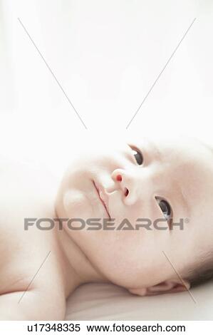 Stock Photography - Baby lying down. Fotosearch
