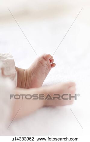 Stock Image - Baby's feet. Fotosearch