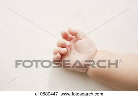 Stock Photo - Baby's hand. Fotosearch