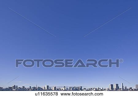 Stock Photo - Blue Sky Over Tokyo Skyline. Fotosearch
