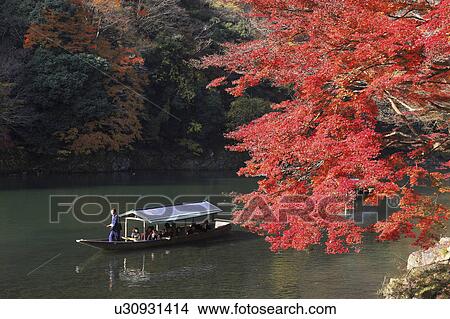 Picture - Boat going down Hozu river in Arashiyama, Kyoto Prefecture, Honshu, Japan. Fotosearch