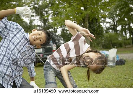 Stock Image - Boy and Girl Bending Sideways. Fotosearch