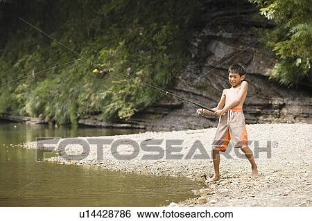 Stock Photograph - Boy fishing in river, Chiba Prefecture, Honshu, Japan. Fotosearch
