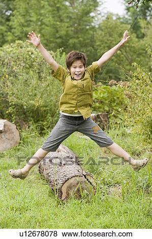 Boy jumping, Chiba Prefecture, Honshu, Japan View Large Photo Image Stock Photo - Boy jumping, Chiba Prefecture, Honshu, Japan. Fotosearch