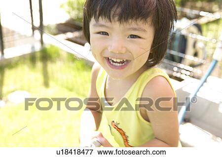 Boy looking at camera smiling, Chiba Prefecture, Honshu, Japan View Large Photo Image Stock Photo - Boy looking at camera smiling, Chiba Prefecture, Honshu, Japan. Fotosearch