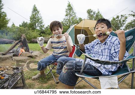 Boys eating at barbecue, Chiba Prefecture, Honshu, Japan View Large Photo Image Stock Photography - Boys eating at barbecue, Chiba Prefecture, Honshu, Japan. Fotosearch