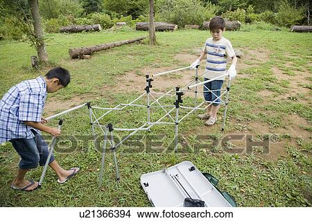 Boys setting up a table, Chiba Prefecture, Honshu, Japan View Large Photo Image Picture - Boys setting up a table, Chiba Prefecture, Honshu, Japan. Fotosearch