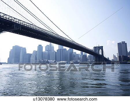 Stock Image - Brooklyn bridge and downtown NYC, New York, USA. Fotosearch