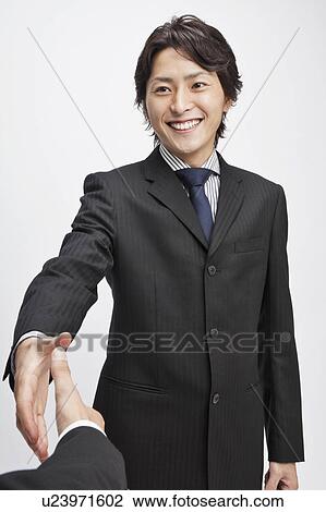 Businessman about to shake hands View Large Photo Image Stock Image - Businessman about to shake hands. Fotosearch