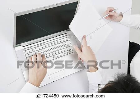 Businessman and businesswoman in a meeting View Large Photo Image Stock Image - Businessman and businesswoman in a meeting. Fotosearch