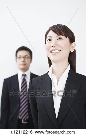 Businessman and businesswoman standing View Large Photo Image Stock Photograph - Businessman and businesswoman standing. Fotosearch