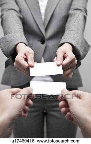 Businessman and businesswoman exchanging business card View Large Photo Image Stock Photograph - Businessman and businesswoman exchanging business card. Fotosearch