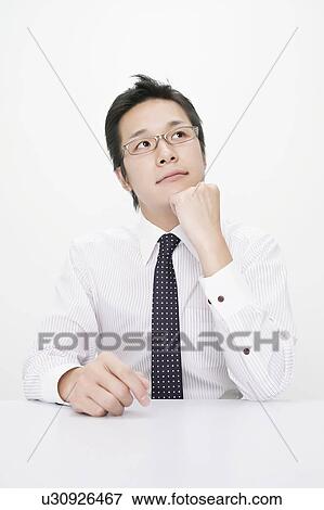 Stock Photo - Businessman contemplating. Fotosearch
