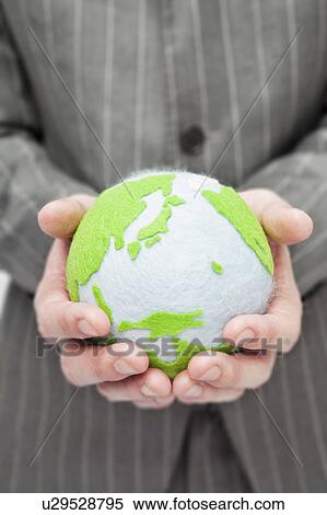 Businessman holding globe in hands View Large Photo Image Stock Photography - Businessman holding globe in hands. Fotosearch