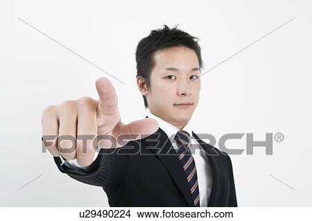 Businessman pointing at camera View Large Photo Image Picture - Businessman pointing at camera. Fotosearch