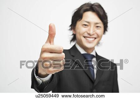 Stock Photo - Businessman with thumbs up. Fotosearch