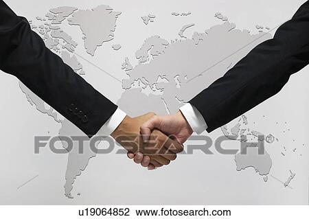 Stock Image - Businessmen shaking hands. Fotosearch