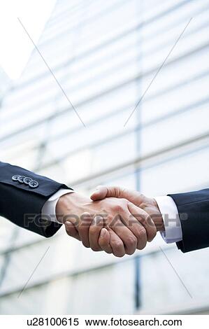 Stock Photography - Businessmen shaking hands. Fotosearch