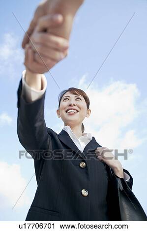 Businesswoman and man shaking hands View Large Photo Image Stock Image - Businesswoman and man shaking hands. Fotosearch