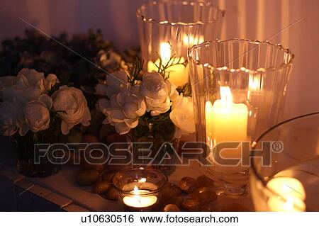 Stock Photograph - Candles and roses. Fotosearch