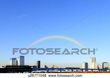 Stock Photo - Commuter Train and Rainbow. Fotosearch
