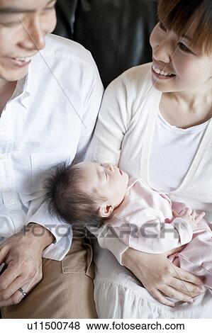 Stock Photo - Couple with a baby. Fotosearch