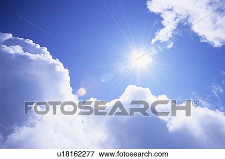 Stock Photo - Cumulus Clouds and Sun. Fotosearch
