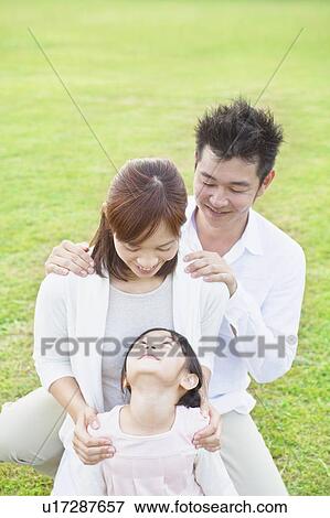 Family with hands on shoulders View Large Photo Image Stock Photo - Family with hands on shoulders. Fotosearch