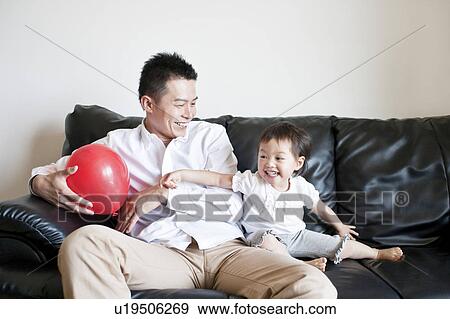 Stock Photo - Father and daughter playing. Fotosearch
