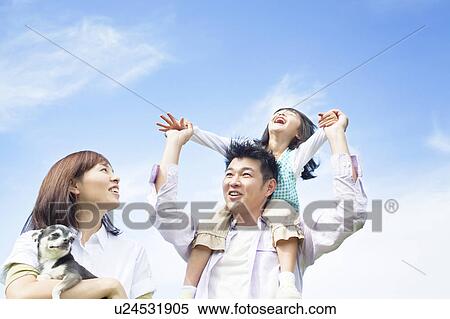 Stock Photography - Father carrying daughter on shoulders. Fotosearch