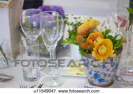 Stock Photo - Flowers in vase on table. Fotosearch