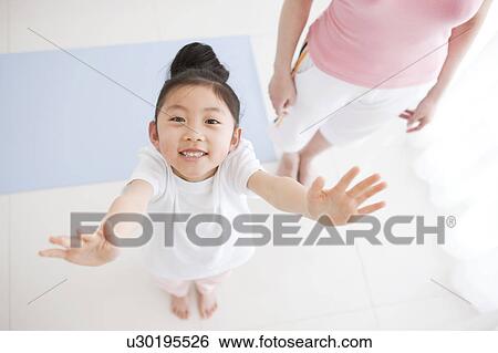 Stock Photograph - Girl Holding Arms Up. Fotosearch