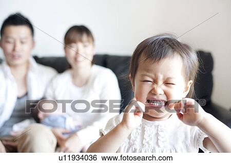 Stock Photograph - Girl making a face. Fotosearch