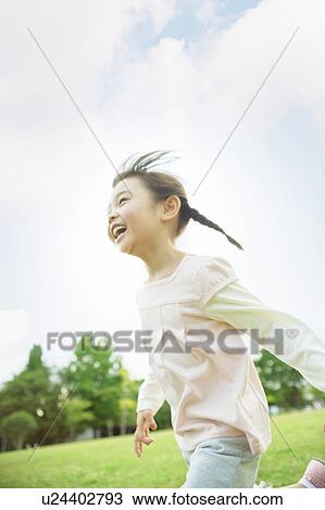 Stock Image - Girl running. Fotosearch