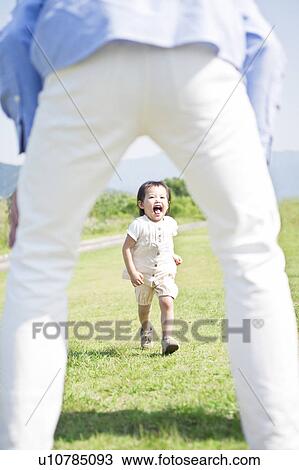 Stock Image - Girl running to father. Fotosearch