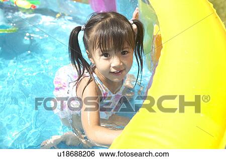 Girl swimming in wading pool, Chiba Prefecture, Honshu, Japan View Large Photo Image Stock Photograph - Girl swimming in wading pool, Chiba Prefecture, Honshu, Japan. Fotosearch