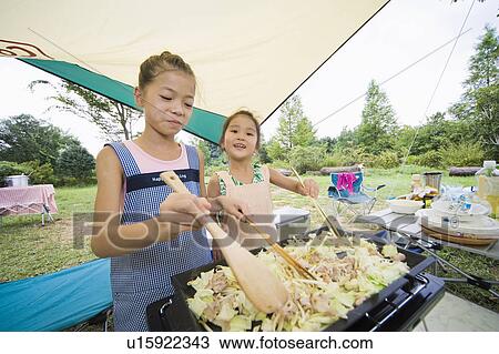 Girls cooking Yakisoba (Fried Noodles) on a grill, Chiba Prefecture, Honshu, Japan View Large Photo Image Stock Image - Girls cooking Yakisoba (Fried Noodles) on a grill, Chiba Prefecture, Honshu, Japan. Fotosearch